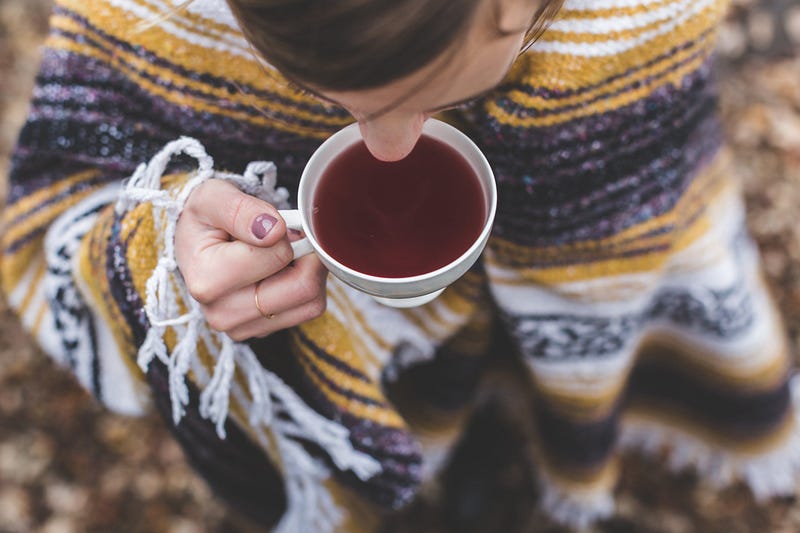 Woman enjoying a calming cup of tea